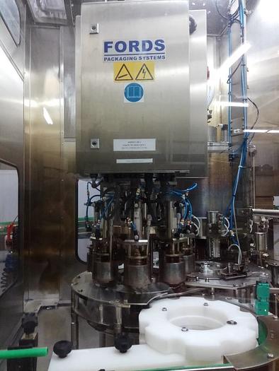 Used WEIGHTPACK BOTTLE FILLING MACHINE WITH FOIL CAP