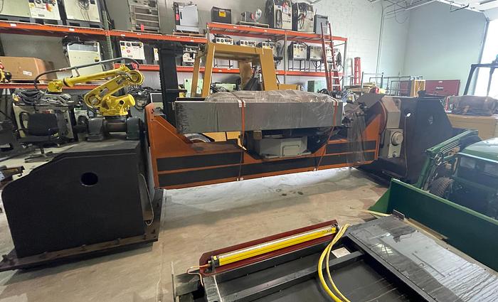 Used FANUC ARCMATE 120iC/10L MIG WELDING CELL WITH 2 AXIS 10' LONG DROP CENTER TRUNNION W/ROTARY CNC TABLE