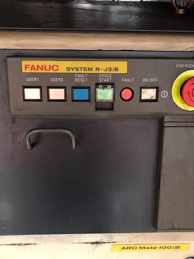 Used FANUC ARCMATE 100iB MIG WELDING CELL WITH A/B SIDED INDEX TABLE AND 7TH AXIS SERVO HEADSTOCK RJ3iB