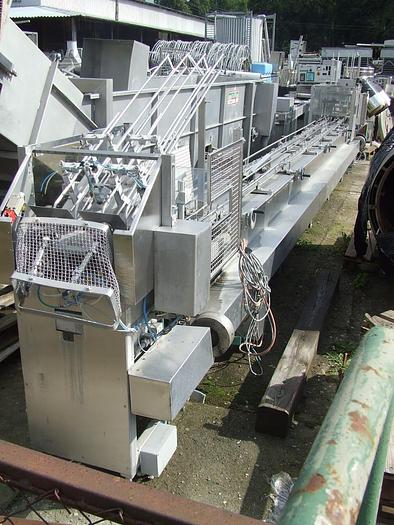 Used Linear packing machine "GRUNWALD" with automatic feeding of boxes and lids