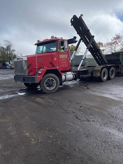 Used 1989 Volvo Autocar Roll-Off with 75000 lb American Hoist