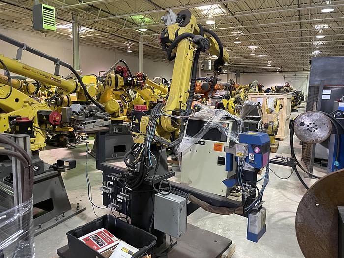 Used FANUC ARCMATE 120iC/10L MIG WELDING CELL WITH 2 AXIS 10' LONG DROP CENTER TRUNNION W/ROTARY CNC TABLE