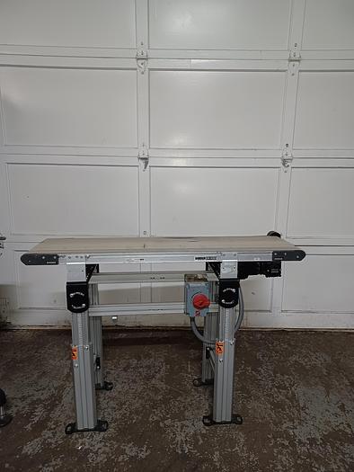 Used Dorner 2200 12" wide 4' long 34" tall PVC belt aluminum frame adjustable legs for height and angle. 277/480 3 phase