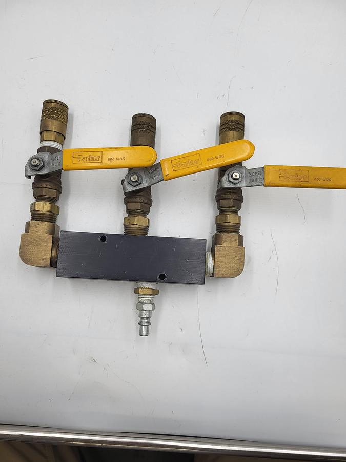Used Pneumatic air manifold with 3 shutoffs 3/8" hook up 4 input / 3 output