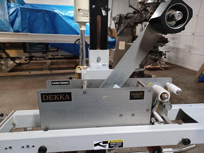 Used Belcor Model 130 Top and bottom case sealer taper with labeler