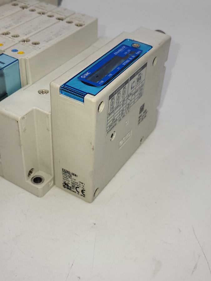 Used SMC HHB-144156 W/ 7 solenoids SY5300 & Two SY5400 air regulated / One: EX260-SIL1 Serial Transmission System output