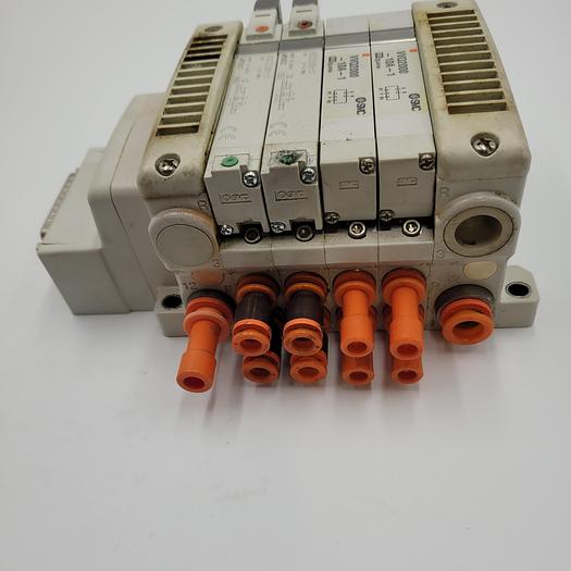 Used SMC four Solenoid Air Control Valves VQ2000-10A-1 mounted on Manifold VV5QC41