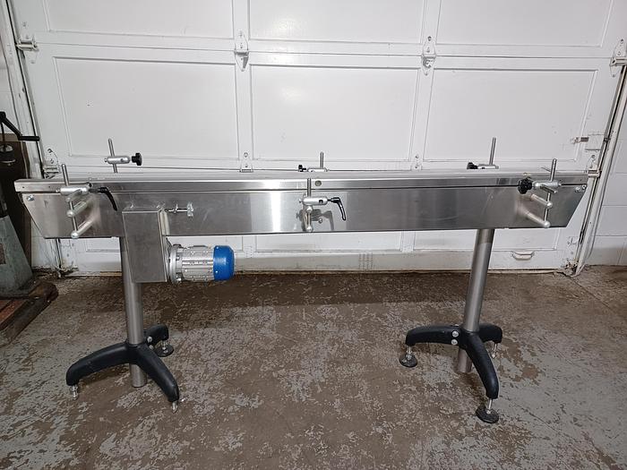 Used 8" wide 5' 10" long 34" tall stainless frame fabric top belt 3 phase 277/480 volt with adjustable feet and side rail.