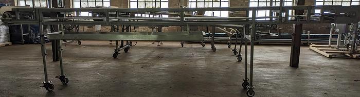Used stainless conveyor 18" wide 17'6" long, white pvc belting, adjustable legs, casters