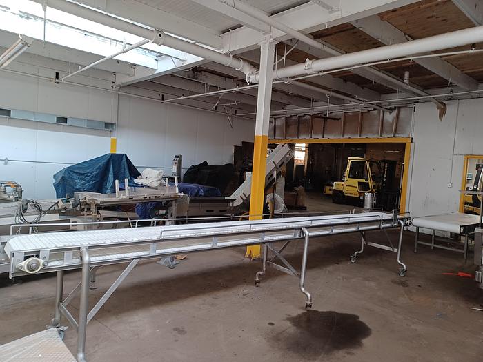 Used Stainless Steel plastic belt conveyor 18' long 36" wide 38" tall on wheels