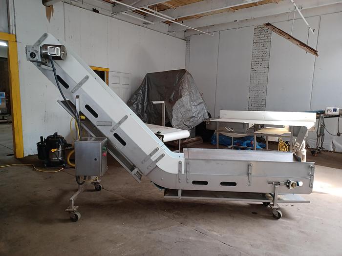 Used Stainless incline conveyor 11' long 12" wide discharge end 6' tall indeed 30" tall 