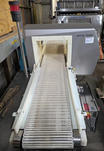 Used Safeline metal detector, 12 1/4" tall x 13 3/4" wide, Stainless conveyor, pne2013umatic reject