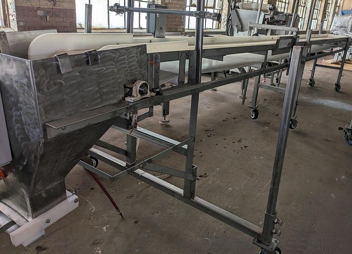 Used conveyor, stainless steel frame, 18" wide 21' long PVC belt adjustable leg with casters.
