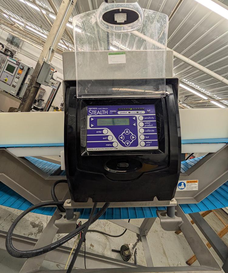 Used fortress Stealth metal detector with Weiler conveyor system