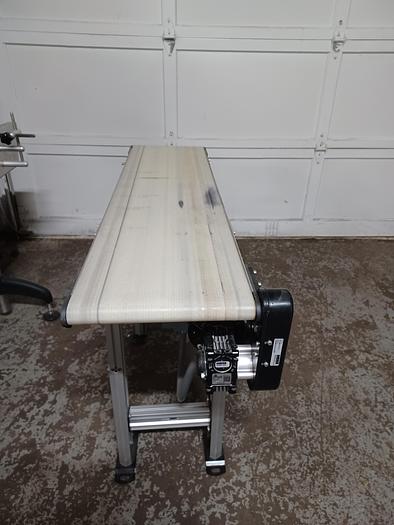 Used Dorner 2200 12" wide 4' long 34" tall PVC belt aluminum frame adjustable legs for height and angle. 277/480 3 phase