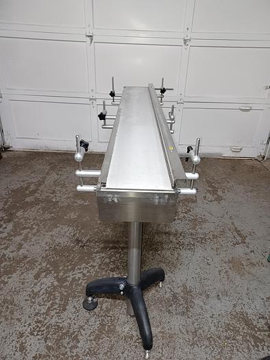 Used 8" wide 5' 10" long 34" tall stainless frame fabric top belt 3 phase 277/480 volt with adjustable feet and side rail.