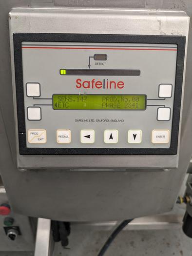 Used Safeline metal detector 17-1/2" wide x 11-3/4" tall. conveyor 16" wide x 100" long. 32" tal