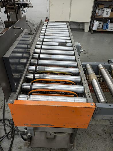 Used roller conveyor, 90 degree transition, pack station