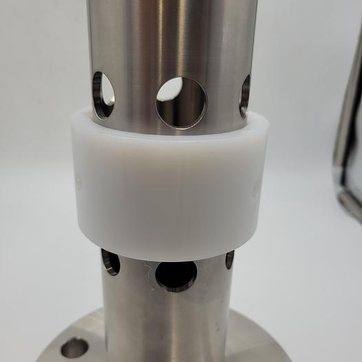 Machined stainless sanitary part 2.52" ID hollow w/ .75" holes (18)/pvc tight fit 3 - 5/16" holes/solid 1-7/16" top-14" tall/4 bolt class 150 flange/2.82" OD