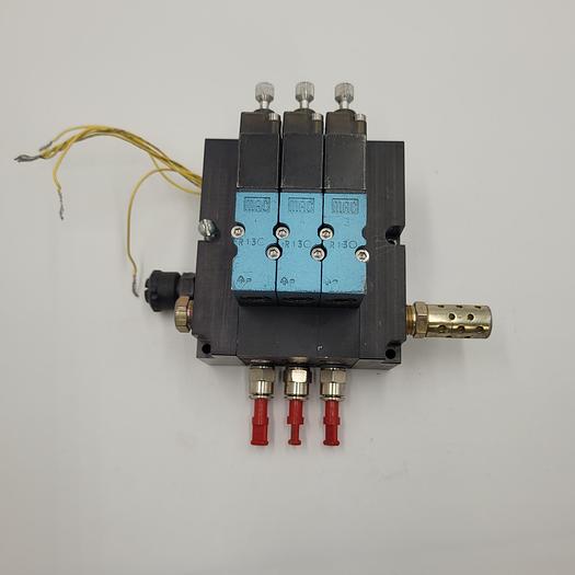 Used MAC THREE ( 46A-L00-00-JAAP-4FH ) Pneumatic valves connected into a manifold with muffler