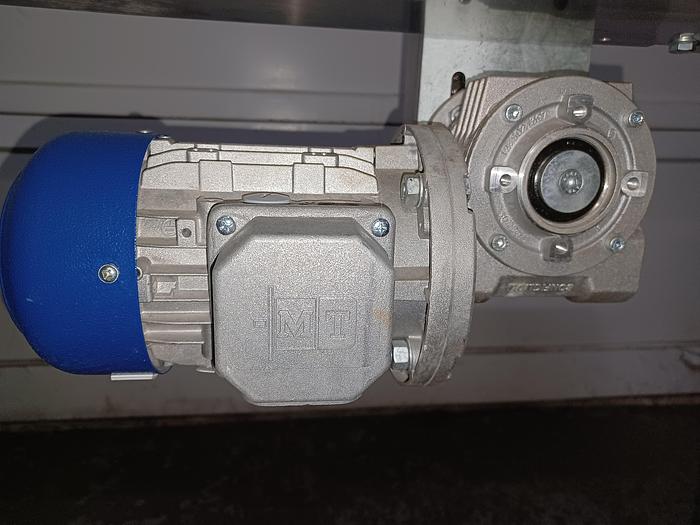 Used 8" wide 5' 10" long 34" tall stainless frame fabric top belt 3 phase 277/480 volt with adjustable feet and side rail.