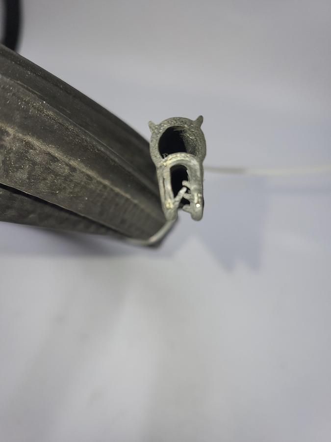 Used Oil-Resistant Rubber 7/16" Wide Top Bulb Buna-N foam -40° F to 212° F metal core Detergent, Grease, Oil, Salt, Steam, Water / 12335a51