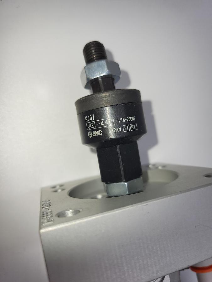 Used SMC NCDGBA32-1300 Round Body Cylinder: 1 1/4 in Bore, 16 in Stroke & floating joint SMC 3G1-44C / 3" mounting plate