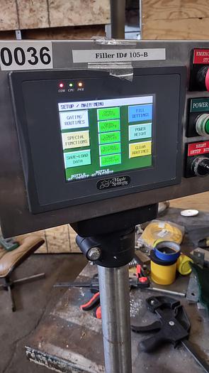 Used Inline Filling Systems - inline 12 spout pressure gravity filler with conveyor