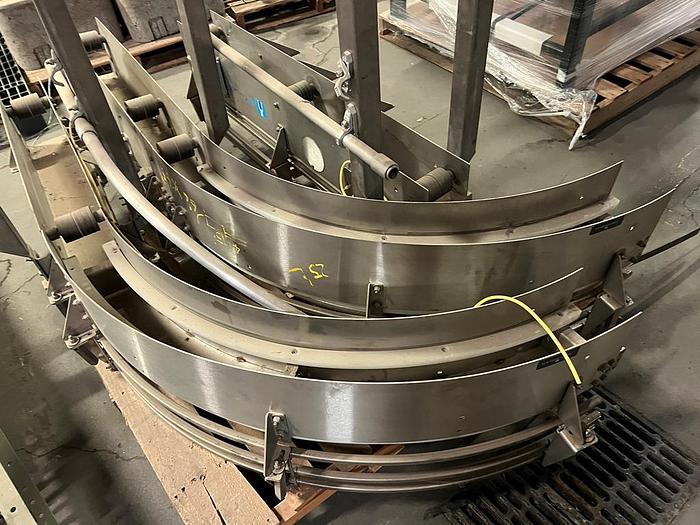 Used Stainless steel case and pallet conveyor to feed palletizer