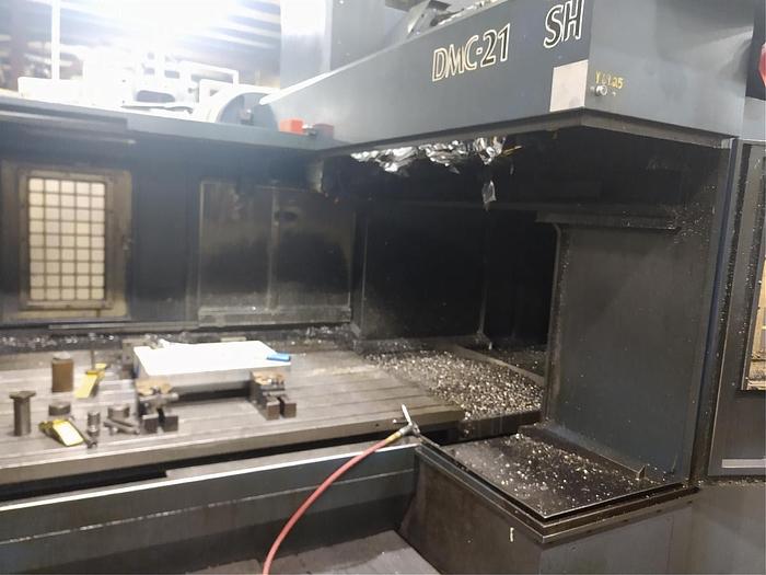 Used 2005 Johnford Bridge Style Vertical Machining Center, Model DCM 2100SH, Table 60" X 86", X Travel 81", Y Travel 72", Z Travel, 31.5", Distance under Rail 37.5", 10,000 RPM, 30HP, ASH A63 tooling, Fanuc CNC.5,