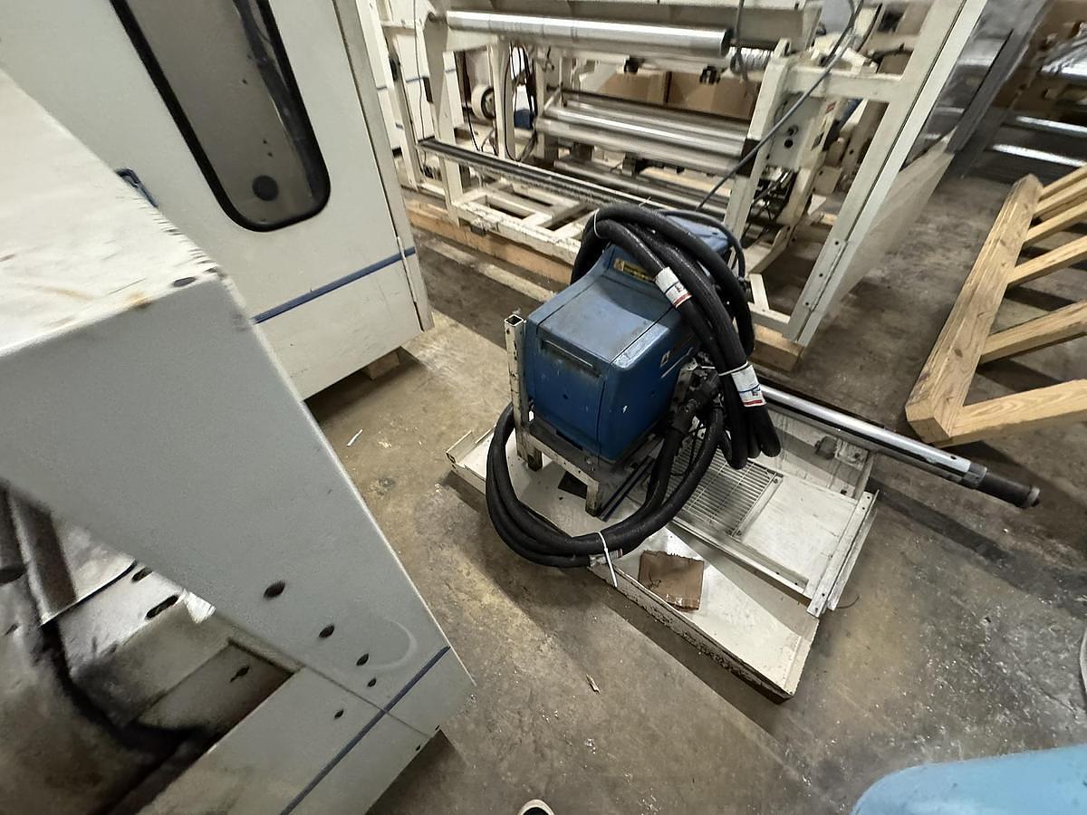 Used Elsner ENR-1000 42" Automatic Nonwoven Wipes Rewinder