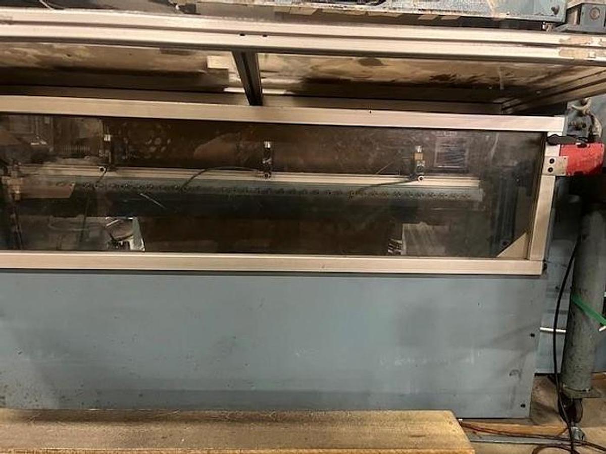 Used 54" Jennerjahn Counter Roll Rewinder with Slitting Rebuilt 2006