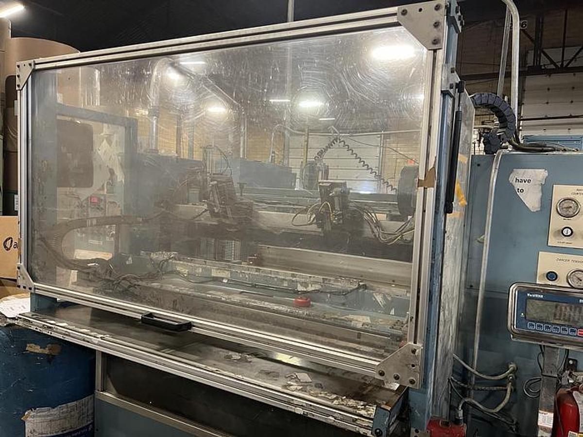Used 54" Jennerjahn Counter Roll Rewinder with Slitting Rebuilt 2006