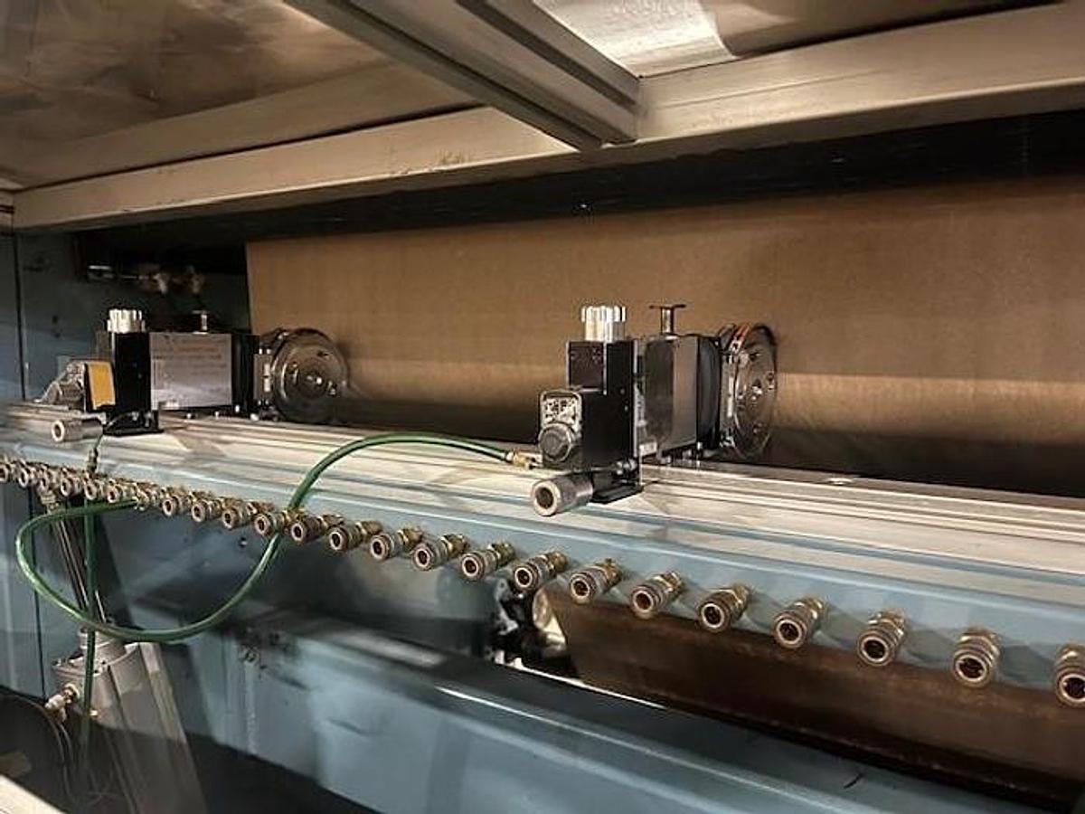 Used 54" Jennerjahn Counter Roll Rewinder with Slitting Rebuilt 2006