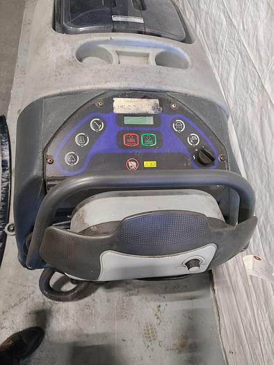 Used Convertamatic Floor Scrubber (A) with Built-in Charger.
