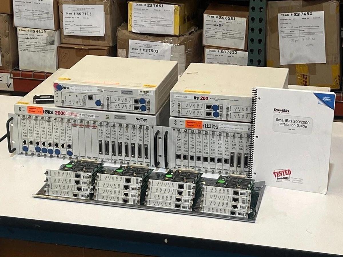 Used Lot of 2 Each: SmartBits 200 & 2000 Systems + 16 Each: SX-7410B & Manual