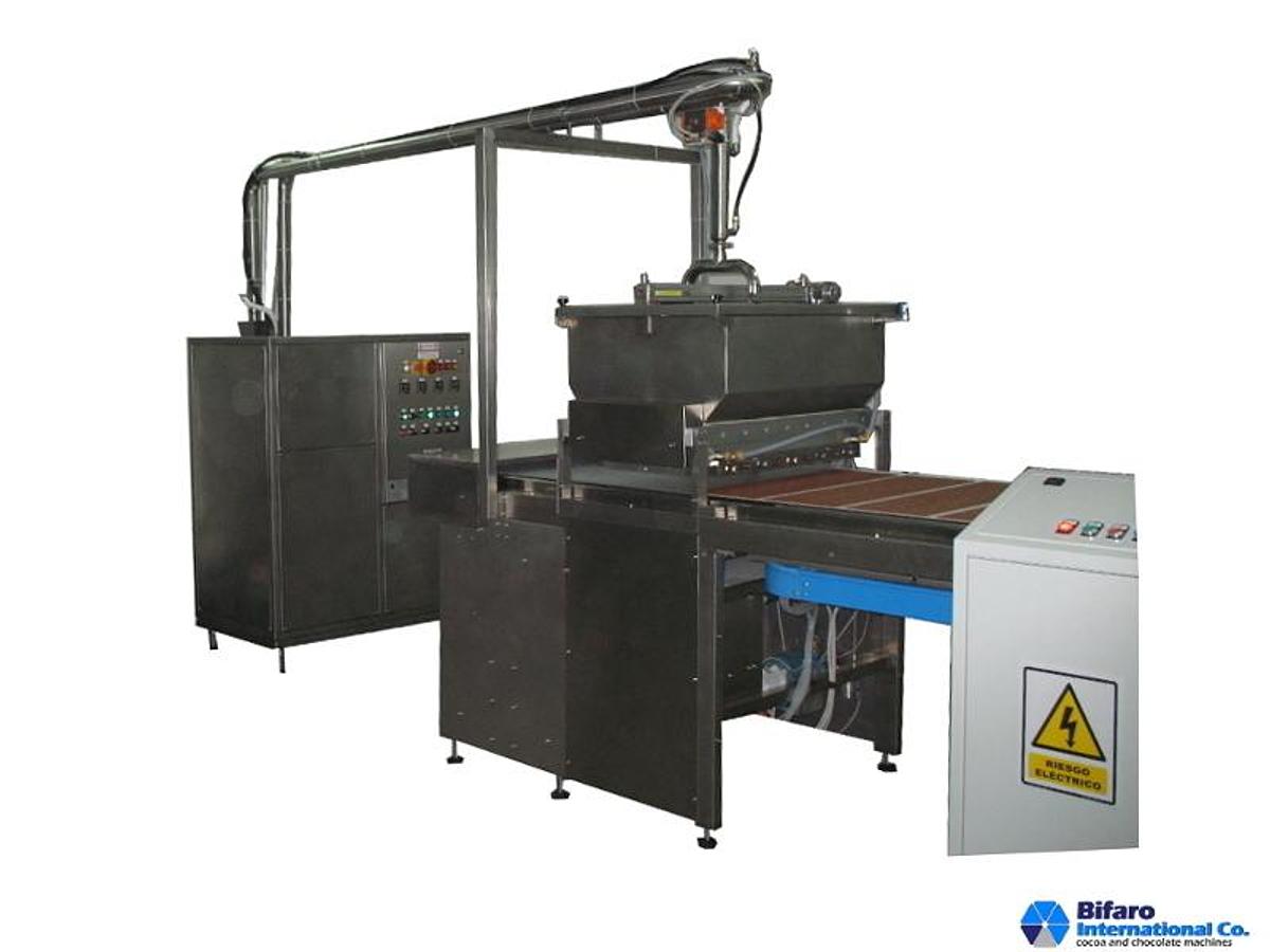 Distributore di dischi di burro di cacao e liquore di cacao