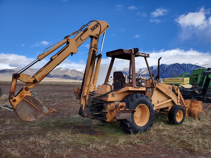 Used Case 580SE Backhoe w/ Attachments