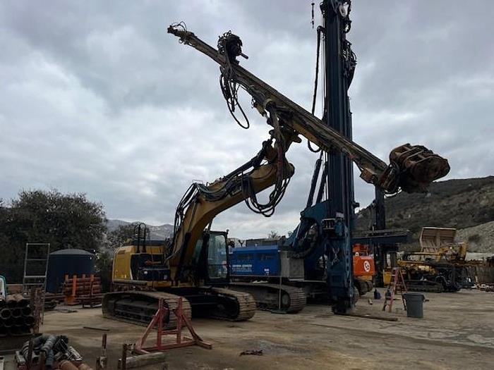 Used DK725 excavator attached