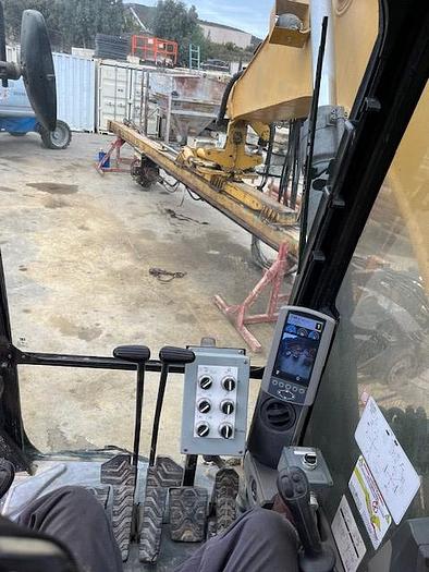 Used DK725 excavator attached