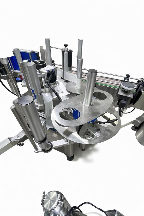 Used AUTOMATIC LABELING MACHINE FOR ROUND BOTTLES  PLC System  Touch Screen control panel  Labels up to 6.5" high-READY FOR SHIPMENT