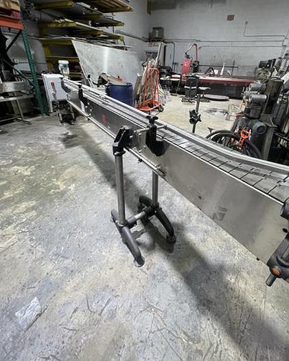 Used STAINLESS STEEL FRAME AND CHAIN-AXON CONVEYOR 15 FEET LONG 7.5 INCHES WIDE AND READY FOR SHIPMENT