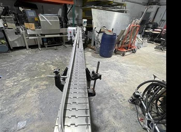 Used STAINLESS STEEL FRAME AND CHAIN-AXON CONVEYOR 15 FEET LONG 7.5 INCHES WIDE AND READY FOR SHIPMENT