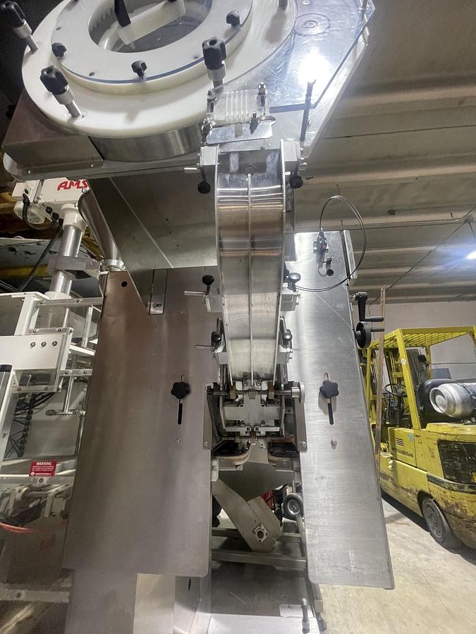 Used AUTOMATIC INLINE BOTTLE CAPPING MACHINE WITH VERTICAL WHEEL CAP SORTER