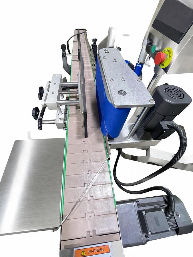 Used AUTOMATIC LABELING MACHINE FOR ROUND BOTTLES  PLC System  Touch Screen control panel  Labels up to 6.5" high-READY FOR SHIPMENT