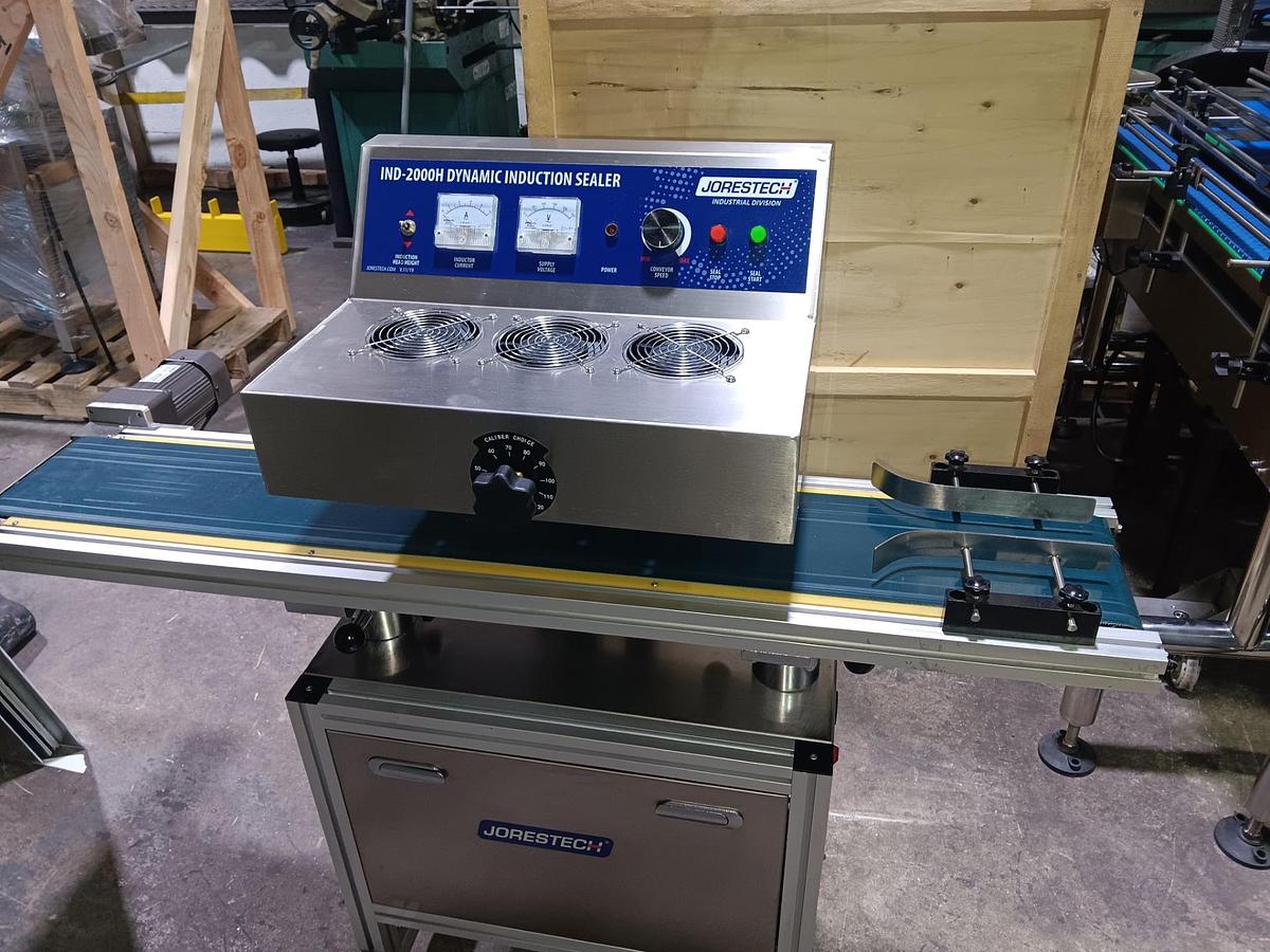 Used Automatic Counting and Dispensing Machine for Capsules, Tablets and Pills includes Unscrambler, Adjustable Capping Machine, Induction Sealer, Bottomless Conveyor, Labeling Machine, Neck Bander/Full Sleeve Applicator w/ Heat Tunnel, Accumulation Rotary Table-READY FOR SHIPMENT