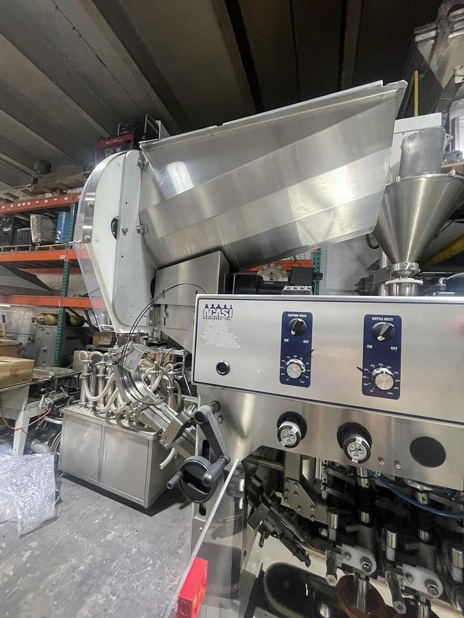 Used AUTOMATIC INLINE BOTTLE CAPPING MACHINE WITH VERTICAL WHEEL CAP SORTER