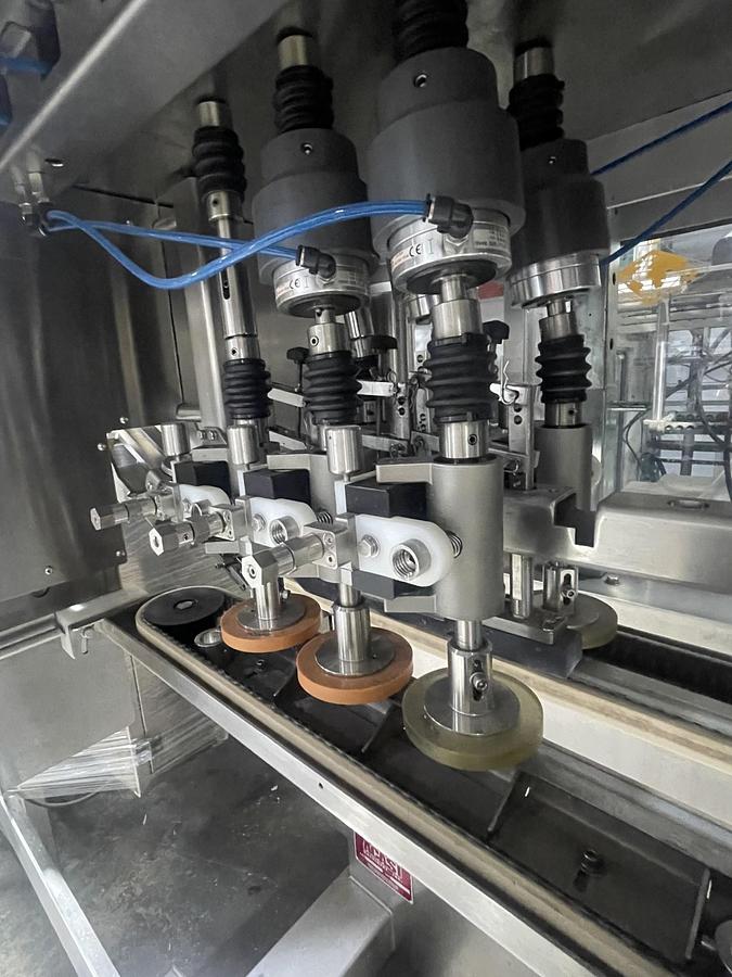 Used AUTOMATIC INLINE BOTTLE CAPPING MACHINE WITH VERTICAL WHEEL CAP SORTER