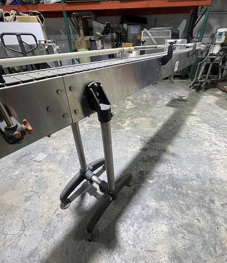 Used STAINLESS STEEL FRAME AND CHAIN-AXON CONVEYOR 15 FEET LONG 7.5 INCHES WIDE AND READY FOR SHIPMENT