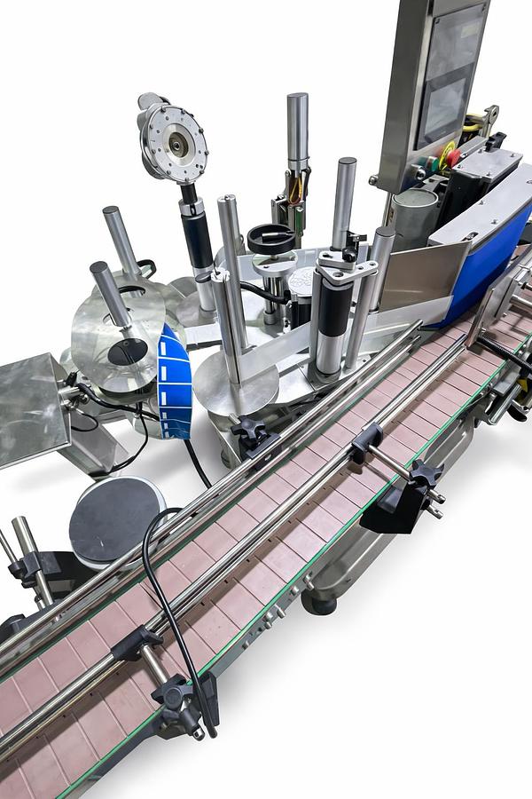 Used AUTOMATIC LABELING MACHINE FOR ROUND BOTTLES  PLC System  Touch Screen control panel  Labels up to 6.5" high-READY FOR SHIPMENT